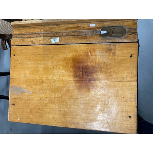 61 - Mid 20th cent. Oak school desk with lift-up lid, pen groove, brass inkwell and sliding cover.