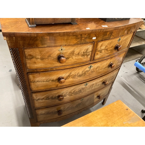 62 - Mahogany bow fronted two over three graduated drawers, canted sides with spiral columns rising off s... 