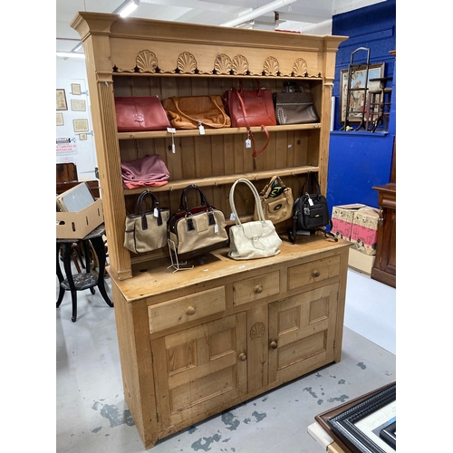 64 - 20th cent. Pine dresser and rack the base three drawers over a twin door cupboard topped by a three ... 