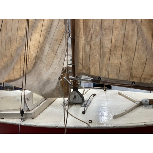 67 - Toys & Games: Treen pond yacht Louisa II, fully rigged, hull painted brown, on stand. 84cm x 118... 