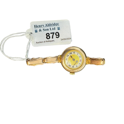 879 - Ladies 9ct. gold trench style wrist watch on expanding gold strap, import marks FM London 1915. Gros... 