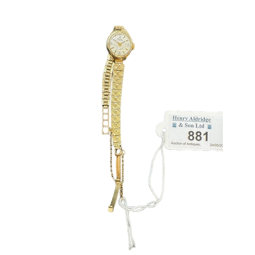 881 - Watches: Ladies 9ct. gold Delma wristwatch with incabloc movement and integral gold strap. Head meas... 