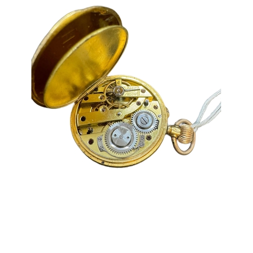 882 - Watches: Ladies 18ct. gold keyless fob watch with floral engraved dial and case. 34mm diameter, gros... 