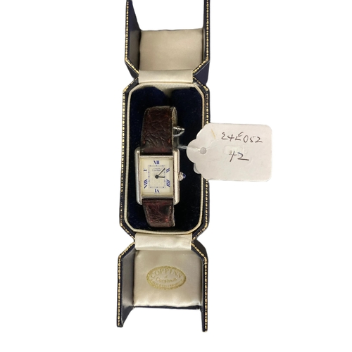 890a - Ladies boxed cartier tank wtch marked 219802CD on a brown leather strap (original).