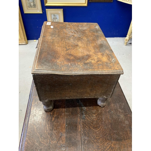 109 - Furniture: An oak box, the elm lid with a moulded edge, on turned feet, 17th century and later, 25cm... 