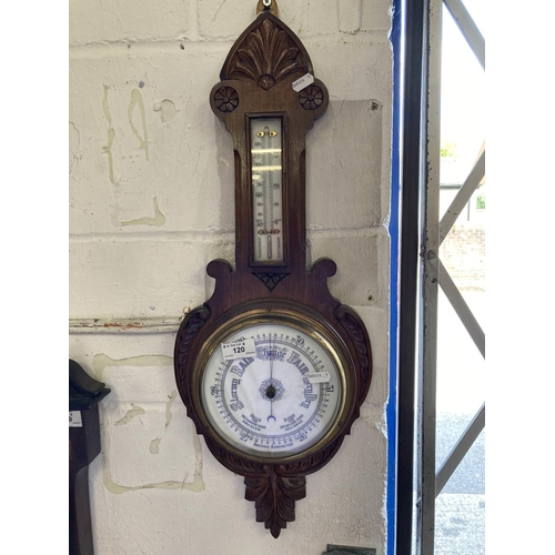120 - 20th cent. Oak aneroid barometer, carved case with a thermometer.