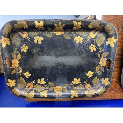 127 - Furniture: THREE REGENCY BLACK JAPANNED TOLE TRAYS: EARLY 19TH CENTURY each pierced with handgrips, ... 