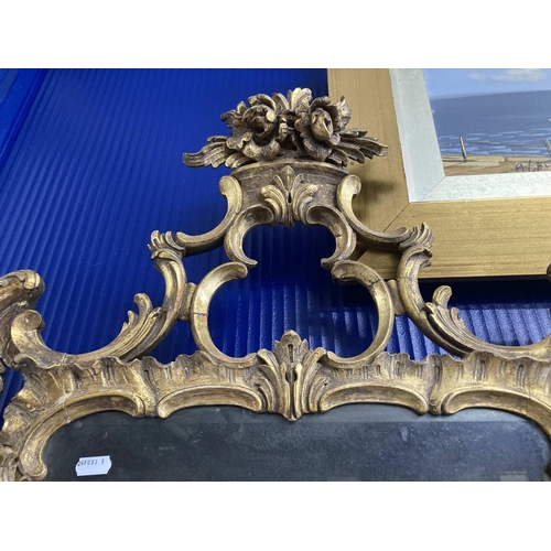130 - 18th cent. Mirror: Gilt mirror in the Rocaille style, glass has desilvered. 60cm x 112cm.