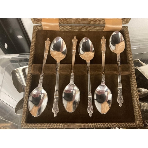 35 - Silver Plate: A boxed set of apostle spoons, a boxed christening set, cruets, antler handled crumb s... 