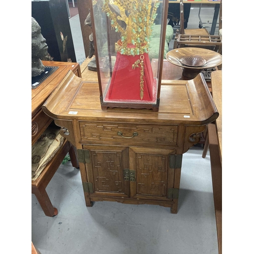 62 - Chinese: Hardwood cabinet with panel top on scroll ends. 76cm x 82cm.