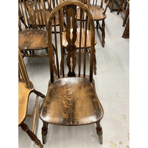77 - Early 20th cent. Harlequin set of twelve aesthetic Windsor chairs, seven plus two carvers. Beech wit... 