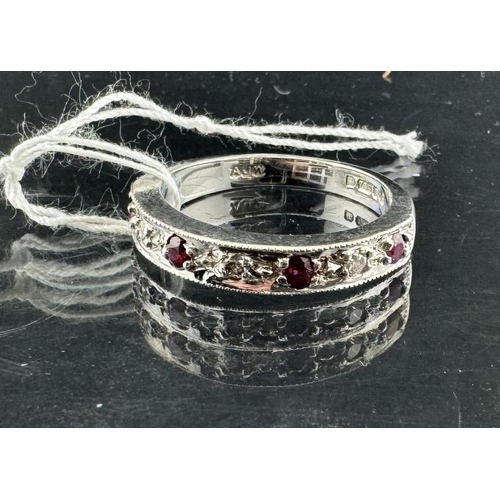 813 - Hallmarked White Gold: 18ct 750 half eternity ring, diamond-ruby set, size O. Approx. 4.9g. Inclusiv... 