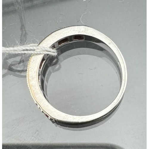 813 - Hallmarked White Gold: 18ct 750 half eternity ring, diamond-ruby set, size O. Approx. 4.9g. Inclusiv... 