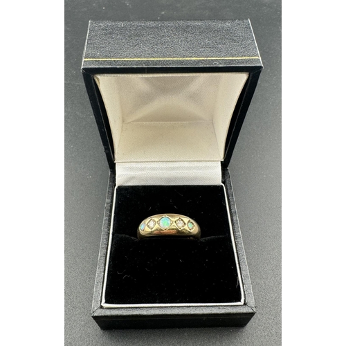 816 - Jewellery: A 9ct gold ring, London 1976, claw set with three opals divided by diamonds. UK size O, 3... 