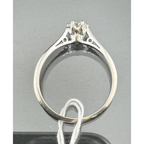 818 - Jewellery: Platinum and diamond solitaire ring, the stone set in a raised mount with pierced effect ... 