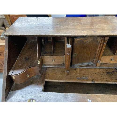 85 - Late 18th/early 19th Century oak bureau with well, secret drawers two short over three long on shape... 