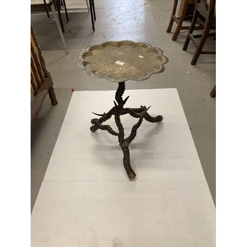 88 - Furniture: A 19th Century brass topped antler horn occasional table. 52cms high.