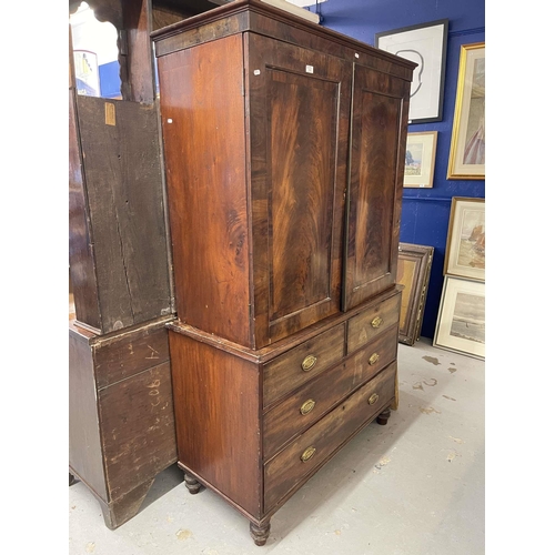 113 - Furniture: Furniture: George III mahogany linen press cupboard. The top has flame curl figuring pane... 