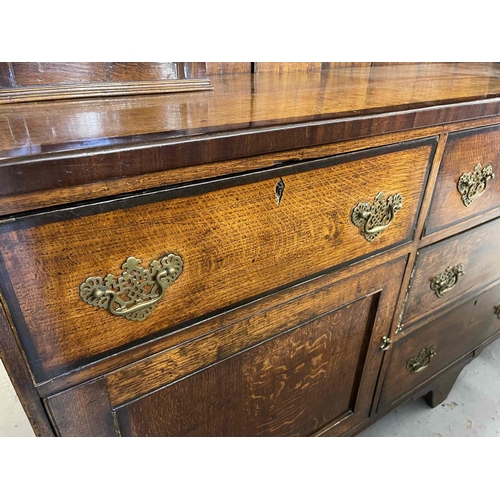 114 - Early 19th cent. Early 19th cent. Oak-enclosed dresser the base with five drawers, two single door c... 