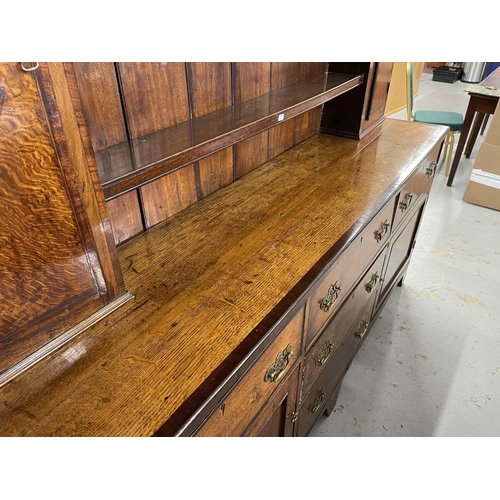 114 - Early 19th cent. Early 19th cent. Oak-enclosed dresser the base with five drawers, two single door c... 