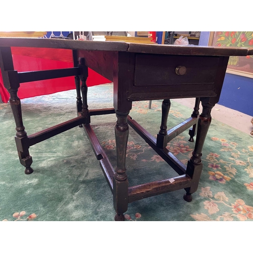 121 - Furniture: Furniture: Late 18th century English oak gate leg table with original drawer to end rail.... 