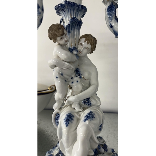 238 - Ceramics: Ceramics: A Dresden candlestick in the form of a young maiden cuddling a putto, upon a bas... 