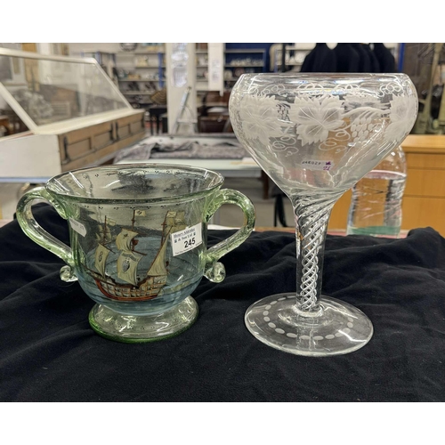 245 - Glassware: 19th Century oversized wine goblet with a double air twist stem, the bowl wheel engraved ... 