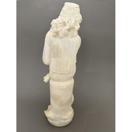 250a - 20th cent. 20th cent. Alabaster figure of a man reading, foot A/F. 37cm.