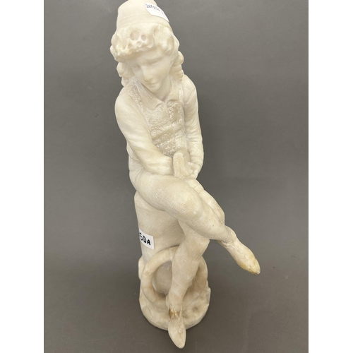 250a - 20th cent. 20th cent. Alabaster figure of a man reading, foot A/F. 37cm.