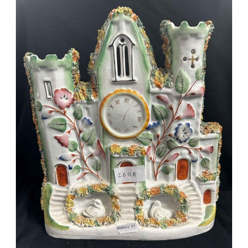 260a - Ceramics: Ceramics: A 19th century polychromed Staffordshire flatback clock tower, the base modelled... 