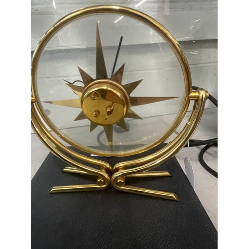 415 - Clocks: Clocks: A 1960s Jaeger Le Coultre brass 8 day mantel clock, the dial a 12 pointed sun within... 