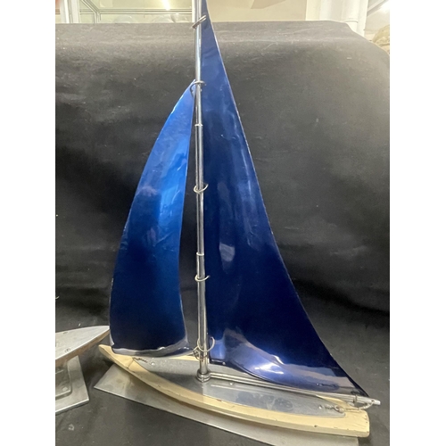 416 - Decorative Arts: Decorative Arts: A 1930s novelty aluminium and wood model of a yacht, the sails blu... 