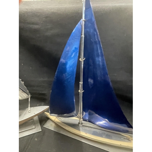 416 - Decorative Arts: Decorative Arts: A 1930s novelty aluminium and wood model of a yacht, the sails blu... 