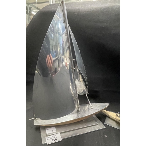 416 - Decorative Arts: Decorative Arts: A 1930s novelty aluminium and wood model of a yacht, the sails blu... 