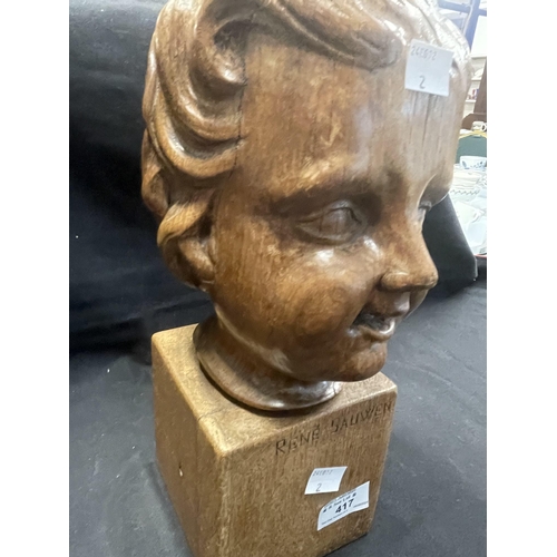 417 - Sculpture: Sculpture: Carved treen head of a child signed Rene Sauwen, 36cm.