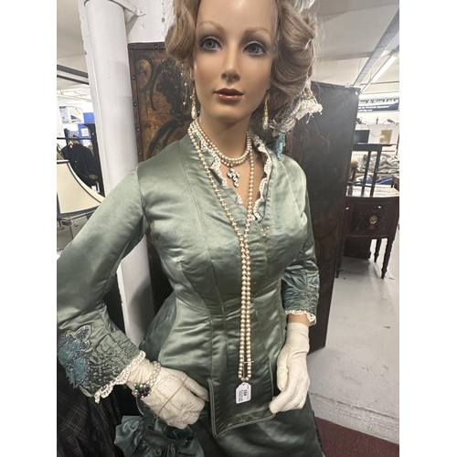 453 - Costume: Costume: Late Victorian day dress decorated with lace ruffles and beadwork, sea green colou... 