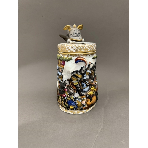 531 - Ceramics: Ceramics: A Capodimonte tankard, decorated in high relief with a continuous battle scene, ... 