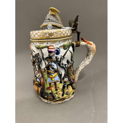 531 - Ceramics: Ceramics: A Capodimonte tankard, decorated in high relief with a continuous battle scene, ... 