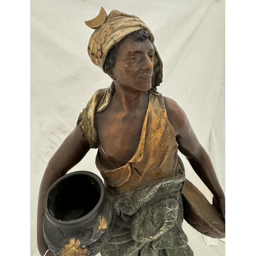 547 - Ceramics: Ceramics: An Austrian polychromed terracotta figure of a water carrier by Johann Maresch,m... 