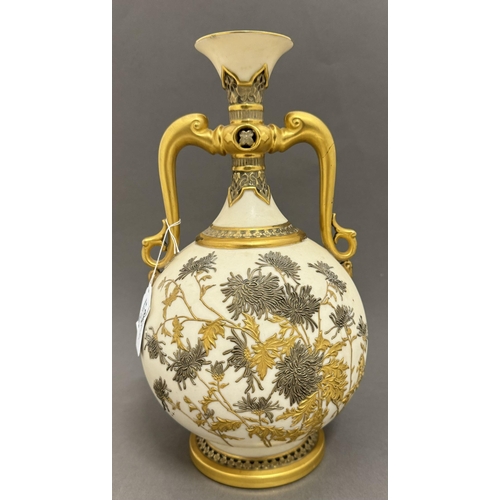 549 - Ceramics: Ceramics: A Royal Worcester blush ivory Wisteria pattern vase, with stylised dolphin handl... 