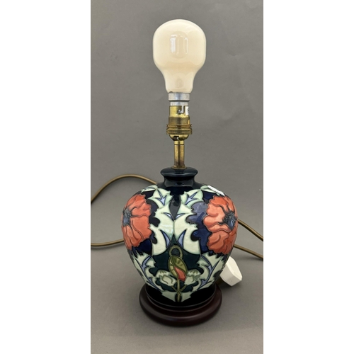 556 - Ceramics: Ceramics: A Moorcroft Pottery lamp decorated in the New Poppy pattern, designed by Rachel ... 