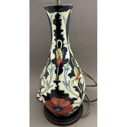 558 - Ceramics: Ceramics: A Moorcroft Pottery lamp decorated in the New Poppy pattern, designed by Rachel ... 