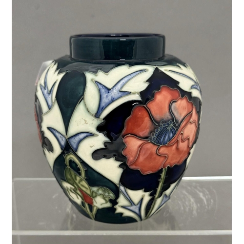 571 - Ceramics: Ceramics: A Moorcroft Pottery tube lined vase in the Poppy Pattern, designed by Rachel Bis... 