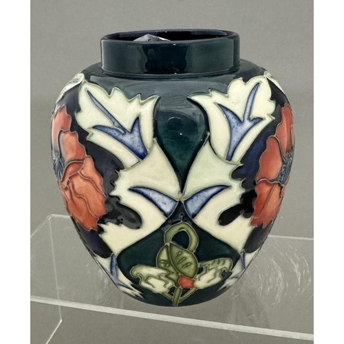 571 - Ceramics: Ceramics: A Moorcroft Pottery tube lined vase in the Poppy Pattern, designed by Rachel Bis... 