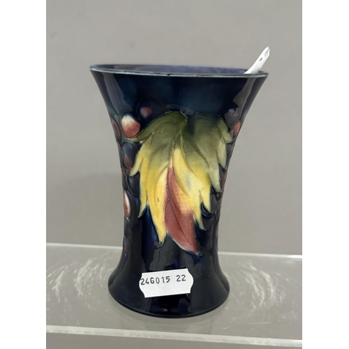 576 - Ceramics: Ceramics: A Moorcroft Pottery trumpet vase painted in the Leaf & Berry pattern to a de... 