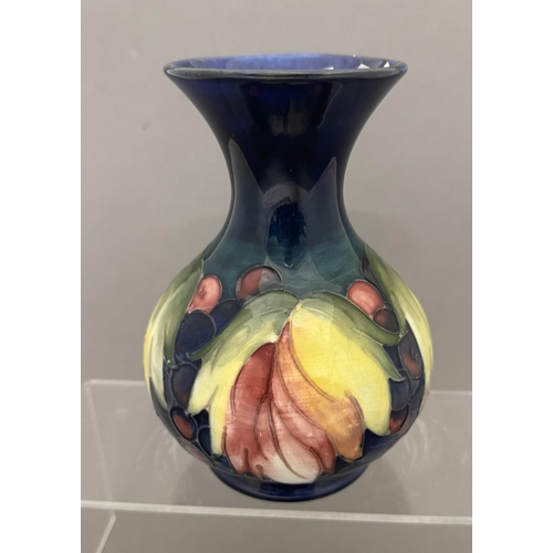 578 - Ceramics: Ceramics: A Moorcroft Pottery Leaf and Berry baluster vase with flared mouth, impressed ma... 