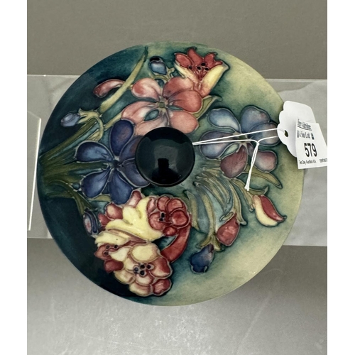 579 - Ceramics: Ceramics: A Moorcroft Pottery powder bowl and cover, painted in the Spring Flower pattern ... 