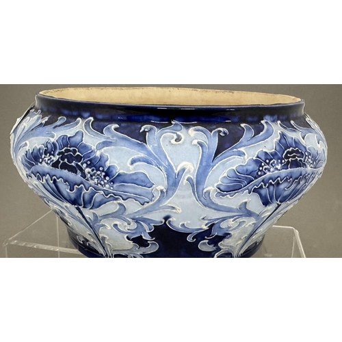 586 - Ceramics: Ceramics: A Moorcroft Florian Ware salad bowl, tubeline decorated in shades of blue . Full... 