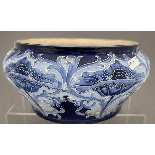 586 - Ceramics: Ceramics: A Moorcroft Florian Ware salad bowl, tubeline decorated in shades of blue . Full... 