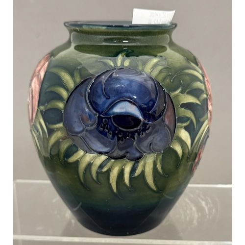 590 - Ceramics: Ceramics: A Moorcroft Pottery Anemone pattern squat vase, with tube lined decoration to a ... 